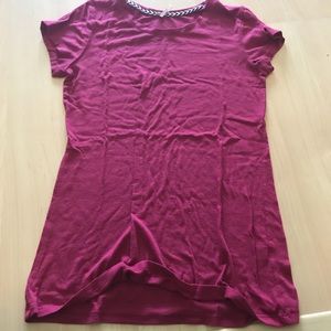 A maroon short sleeved shirt
